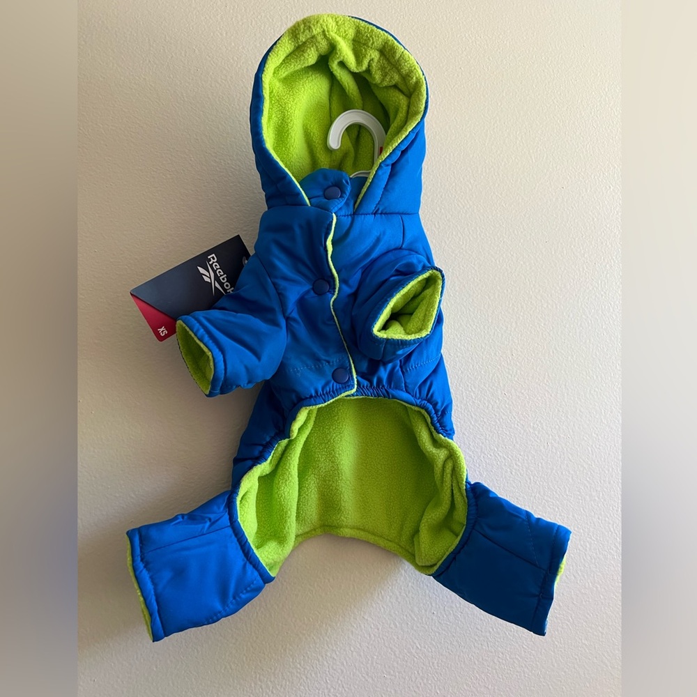 REEBOK Dog Snow Suit. Fleece Lining for Warmth. Snap Closure. Slash for Lease.